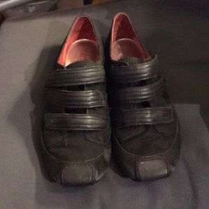 Velcro strapped sneakers.